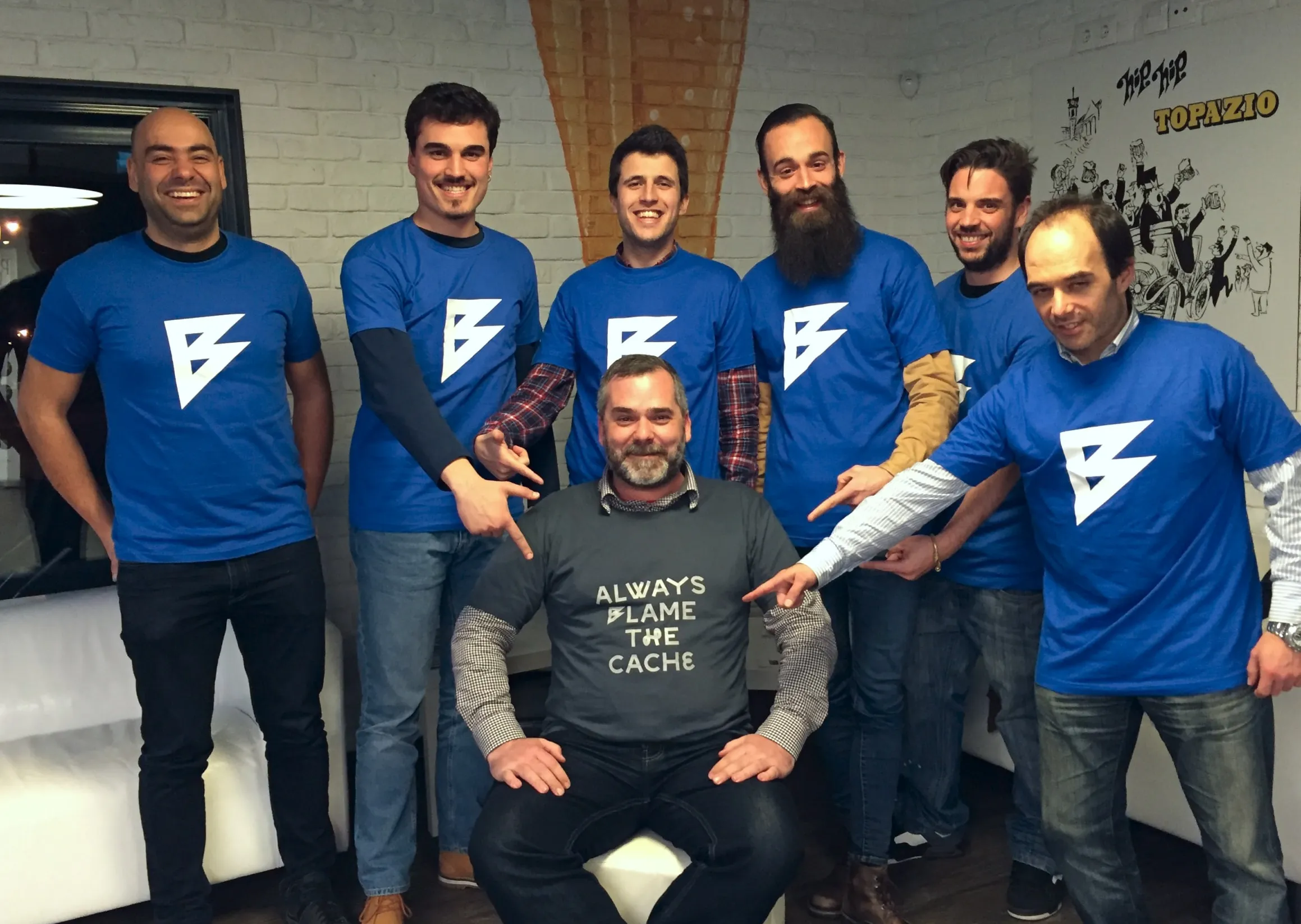 The Büro Team pointing to Alex’s "Always Blame The Cache" shirt